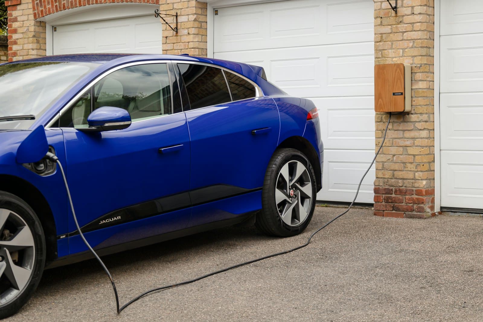 EV plugged in at home—garage or driveway installation