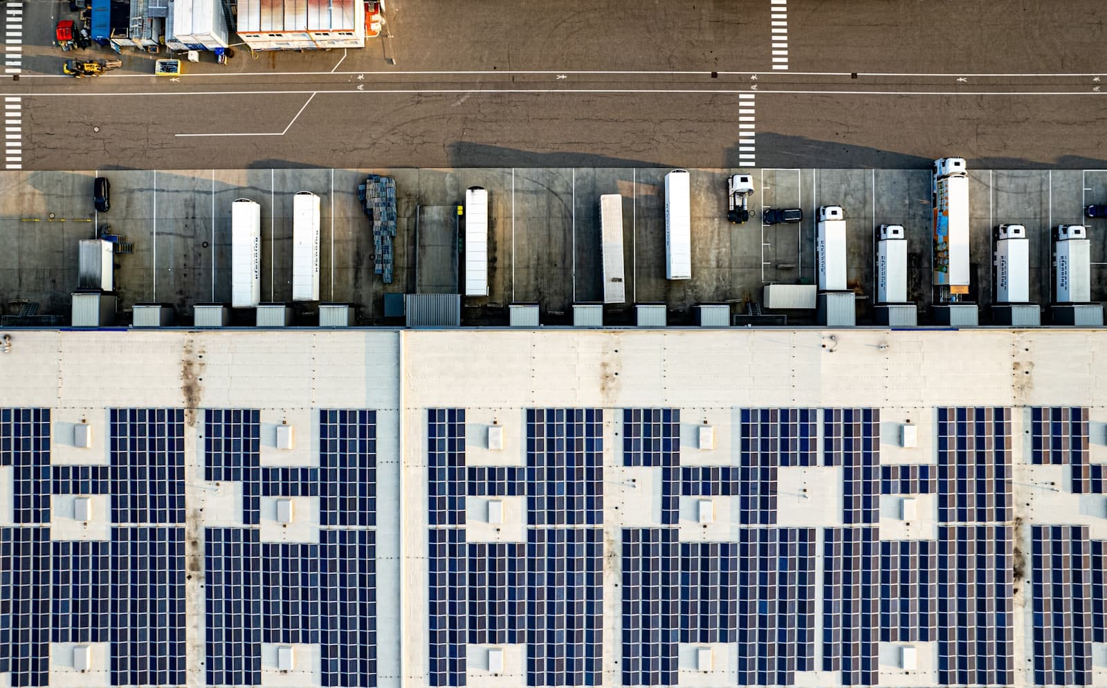 Aerial view of a parking lot with solar panels—solar carport installation